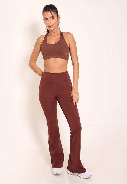 Calça Flare de Compressão Com Bolsos Laterias